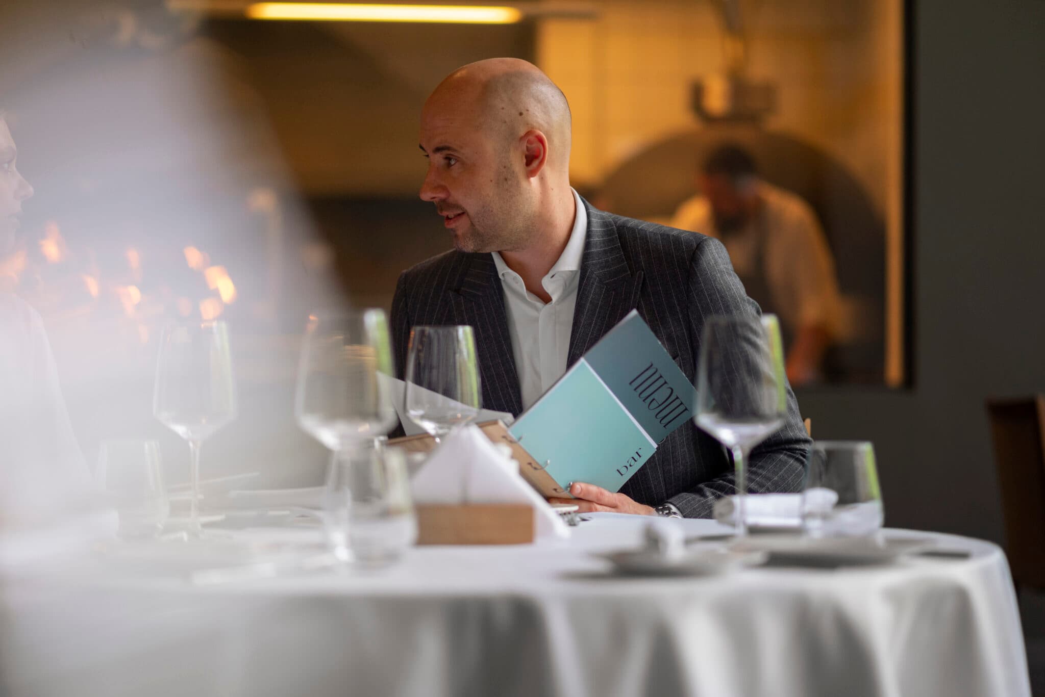 Guests dining at a waterfront restaurant